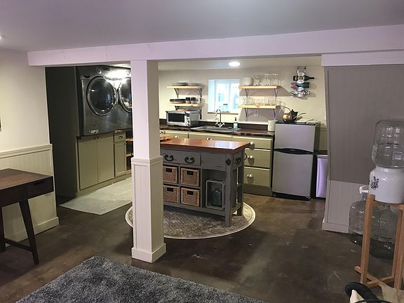 Lower level main area, large enough to be a family room- private exit to rear entertaining area