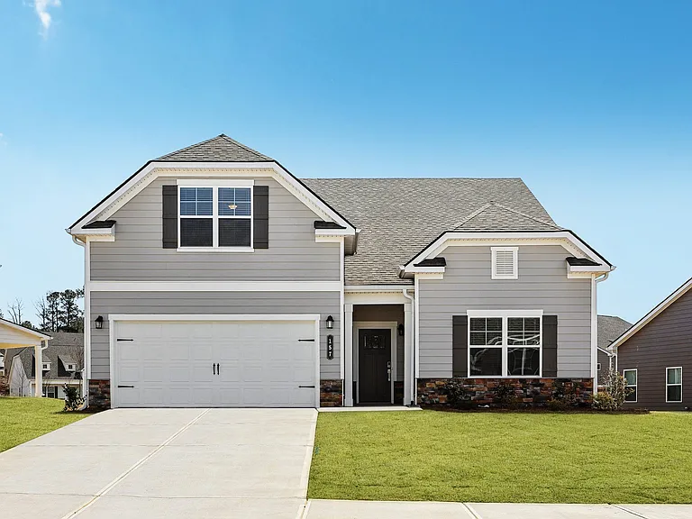 Exterior of the Maxton, two story home with a private driveway and attached garage.