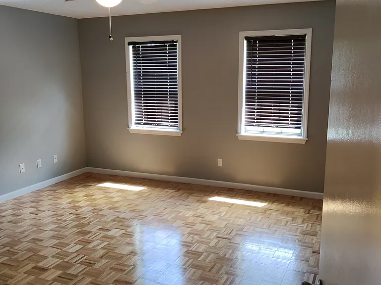 Spacious Master bedroom has hardwood floors, 2 windows, 2 walk in closets and large customized private bathroom.