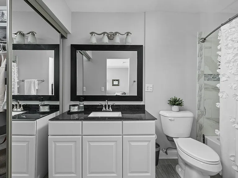 2nd primary suite bathroom with tub and shower combo. Large Walk in closet to the left.
