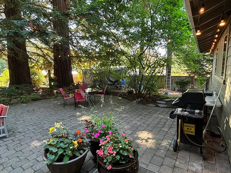 Backyard patio looking west out the dining room sliding glass door, natural gas BBQ