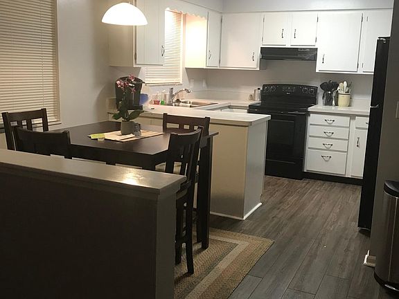 Dining room and Kitchen; family room left of divider