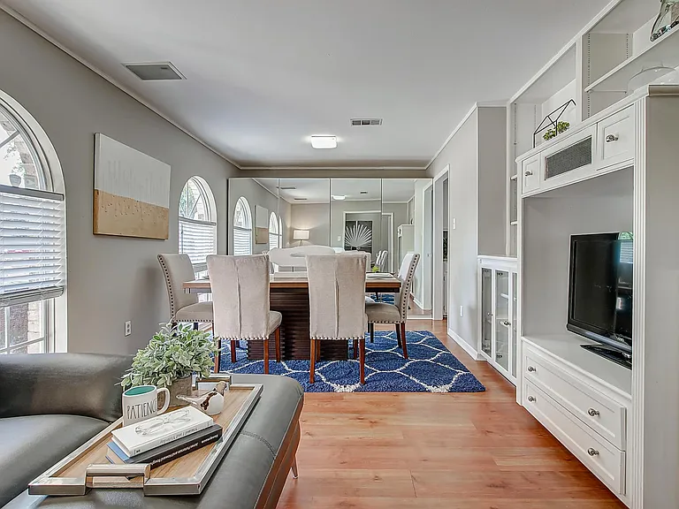 front room has built-in cabinets and cieling to floor closets behind mirror doors