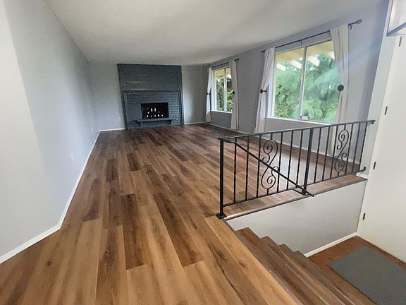 Very large Living Room with Wood burning fireplace. Great territorial view!