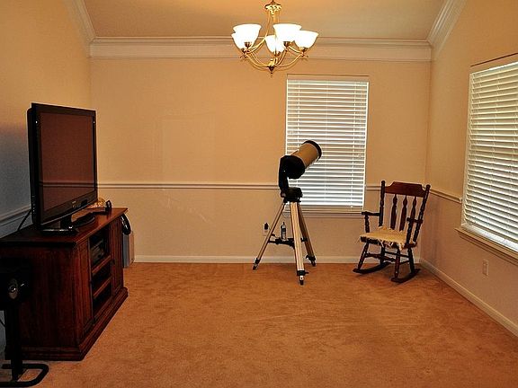Just inside the front door is the large dining room with crown moulding and chair rail moulding