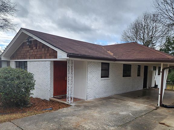 Carport with side entrance to kitchen