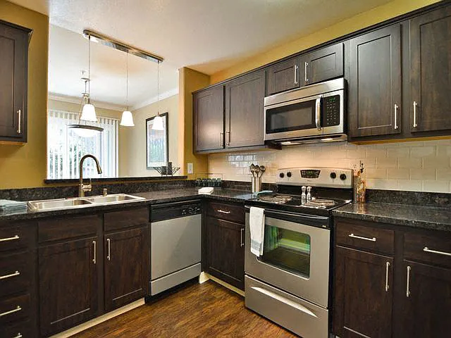 Gourmet kitchens with caesarstone countertops and decorative backsplash at Crooked Oak at Loma Verde Preserve, California, 94949