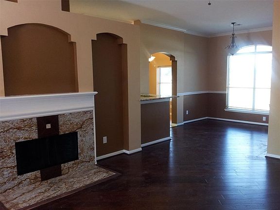 The fireplace is a beautiful focal point which adds much war