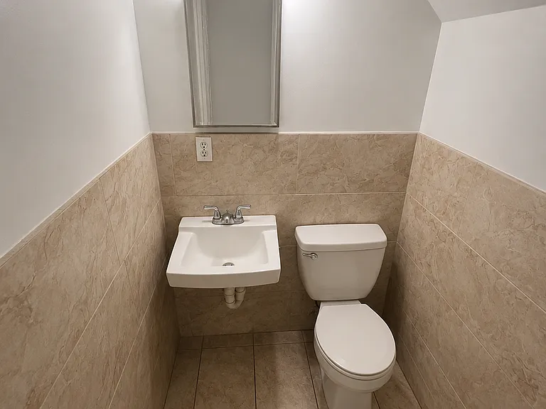 Clean, well-maintained shared bathroom conveniently located just across the hall from the bedroom.