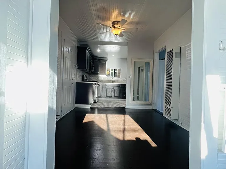 First room / first-look: stepping through sliding-glass doorway.