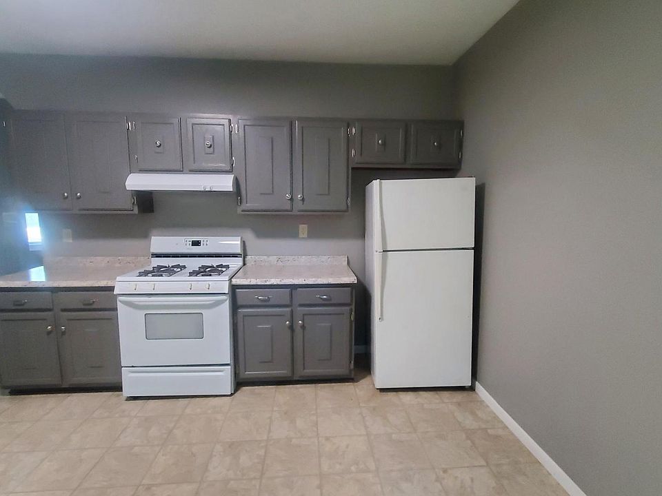Kitchen with stove and refrigerator