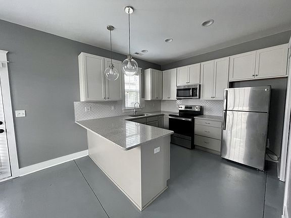 Open and airy, lots of natural light. Floors redone and freshly painted.