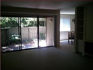 wall of window overlooking spacious patio