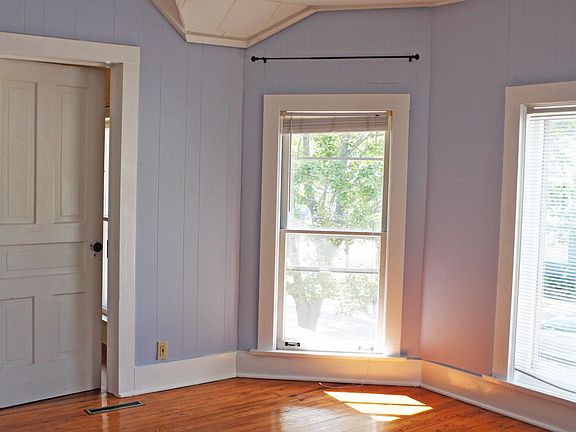 SW corner of front bedroom. Hard pine floor.