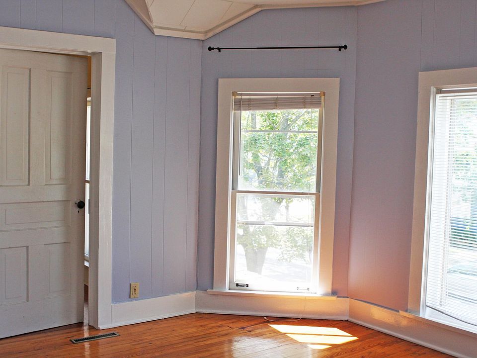 SW corner of front bedroom. Hard pine floor.