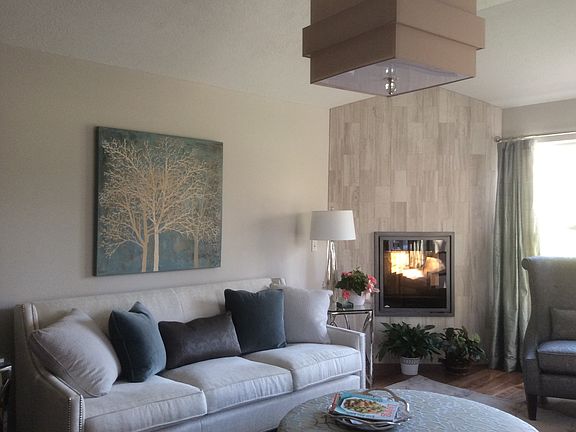 Tiled wall with elec firepla