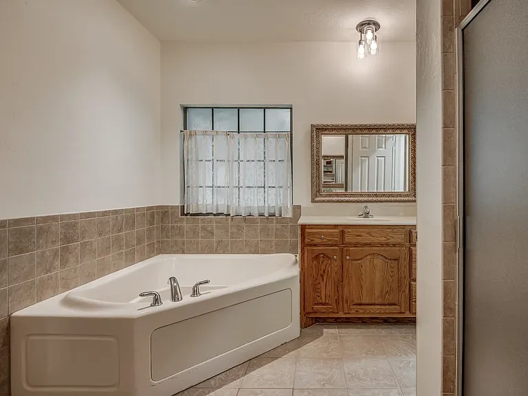 His / Her Bathroom vanity in Master Bathroom. Other side of vanity shown in the following photo.