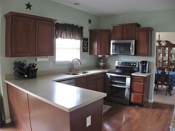 Kitchen: Corian countertops, recent new range/oven and microwave.