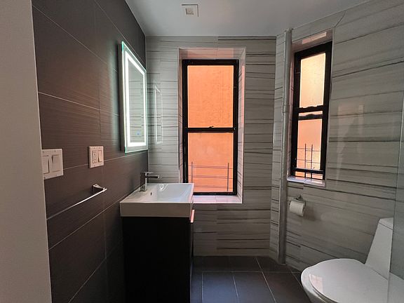 5th image of 411 E 118th St APT 15