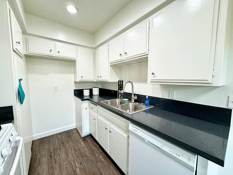 Kitchen with dishwasher and new faucet fixture
