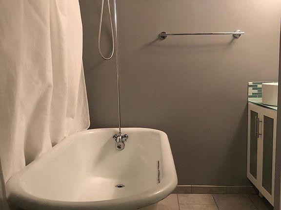 Full bathroom with clawfoot tub.