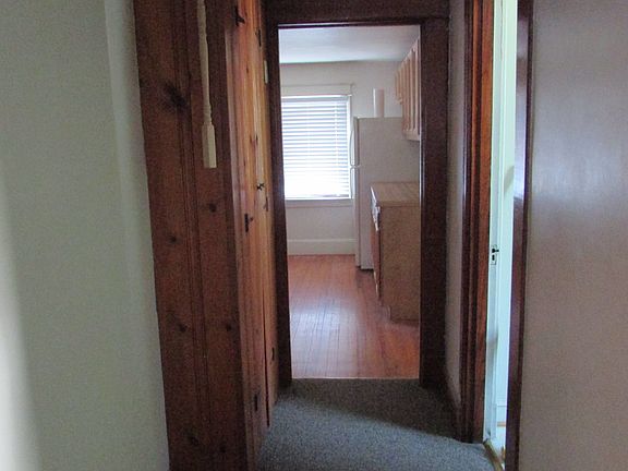 Top of the stairs, the hallway continues to the right, down to the kitchen, linen closet on the left, bathroom on the right .
