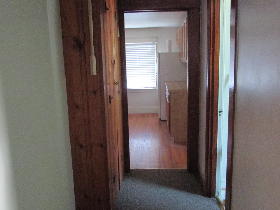 Top of the stairs, the hallway continues to the right, down to the kitchen, linen closet on the left, bathroom on the right .
