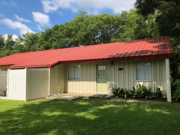 Back entrance with bicycle parking. Laundry room is located behind door to the left.