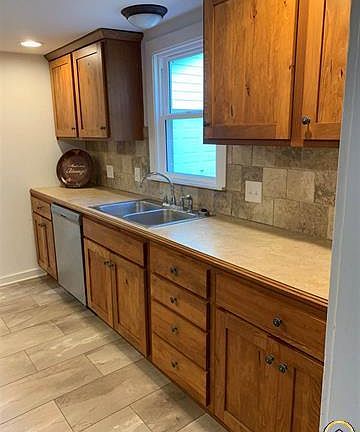 Kitchen cabinets and dishwasher.