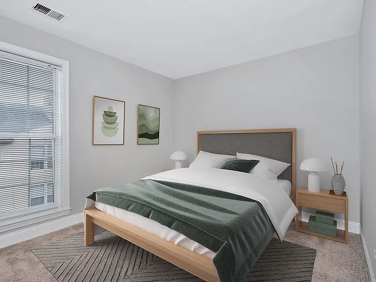 Spacious bedroom with plush carpeting