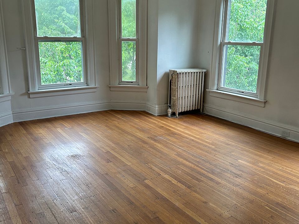 Large living room with bay window overlooking Colonial Circle.