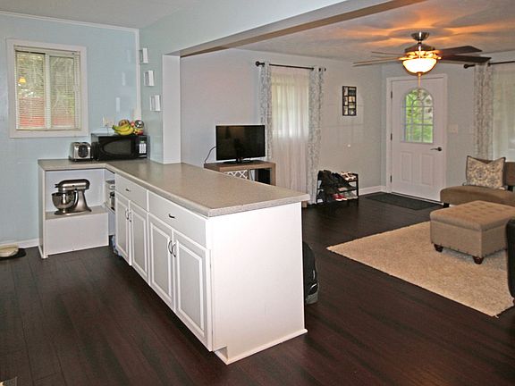 The open floor plan gives the feeling of a much larger home and makes it simple for the cook to be part of the action while preparing meals. Plenty of cabinet and counter space make cooking a breeze plus it's possible to pull up a stool to the counter and chat.