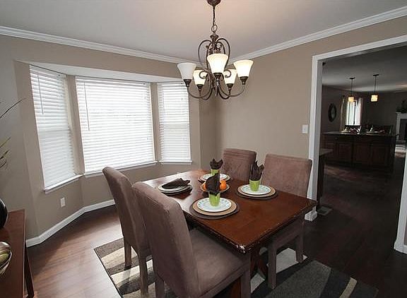 Dining room boasts new hardwood and a nice three bay window.