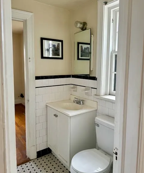 jack-and-jill bathroom with tiled tub and shower