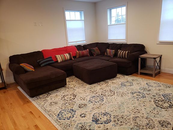 Large, L-shaped couch with matching ottoman