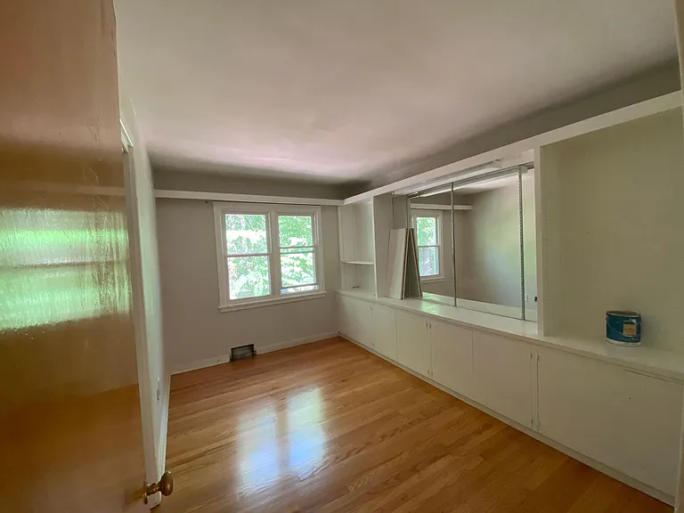middle bedroom (closet doors and shelves will be reinstalled). It's just off the living/dining room and would make a fantastic home office. Lots of light and lots of storage.