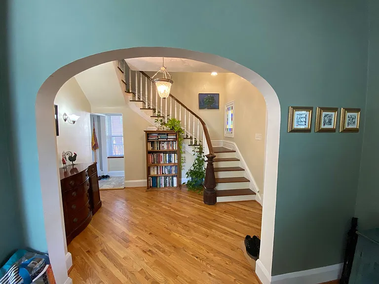 Arches leading to the Foyer and look at that stairwell!