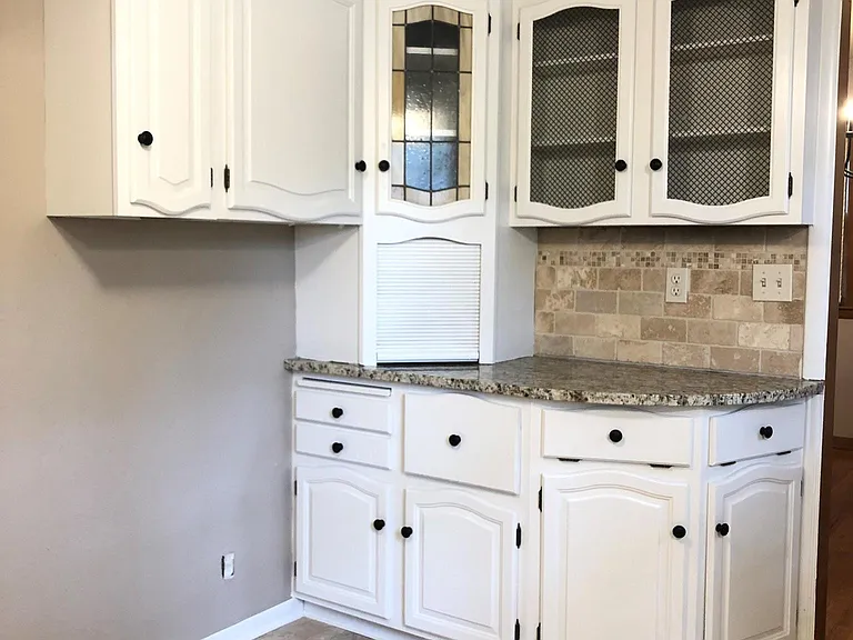 Kitchen with granite countertops.