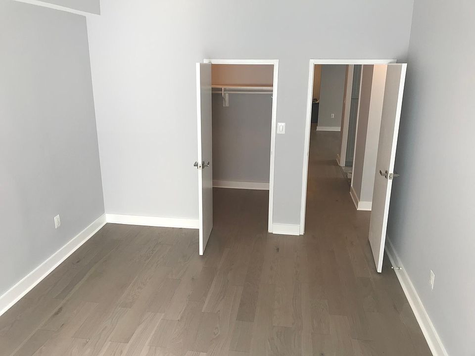 far side of bedroom with walk in closet