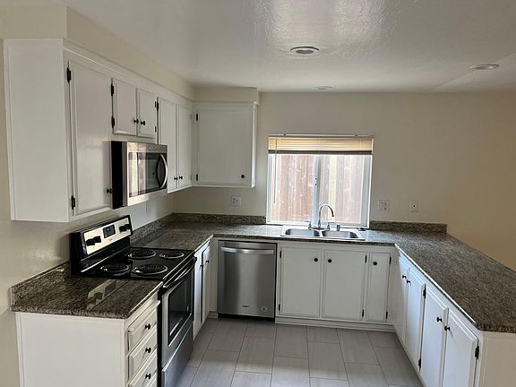 All electric kitchen with tile new tile flooring..