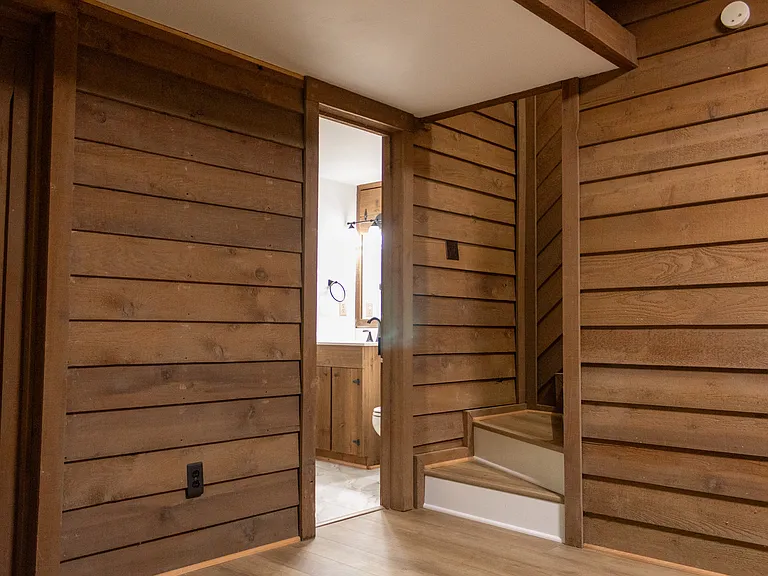 At the base of the stairs is the basement bathroom.