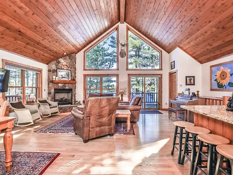 Open concept Dining Room (seats 8), Living Room and Kitchen with walk out to Large Balcony with incredible lake views.