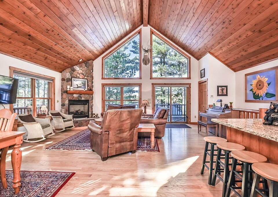 Open concept Dining Room, Living Room and Kitchen with walk out to Large Balcony with incredible lake views.