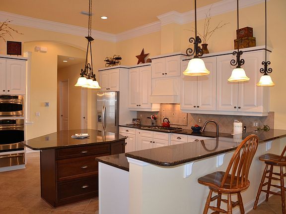Gourmet Kitchen With Custom Cabinetry & Gleaming Granite Counters