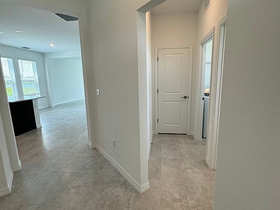 foyer leading to laundry room & half bath