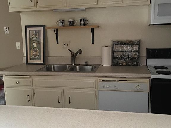Looking into kitchen from breakfast bar