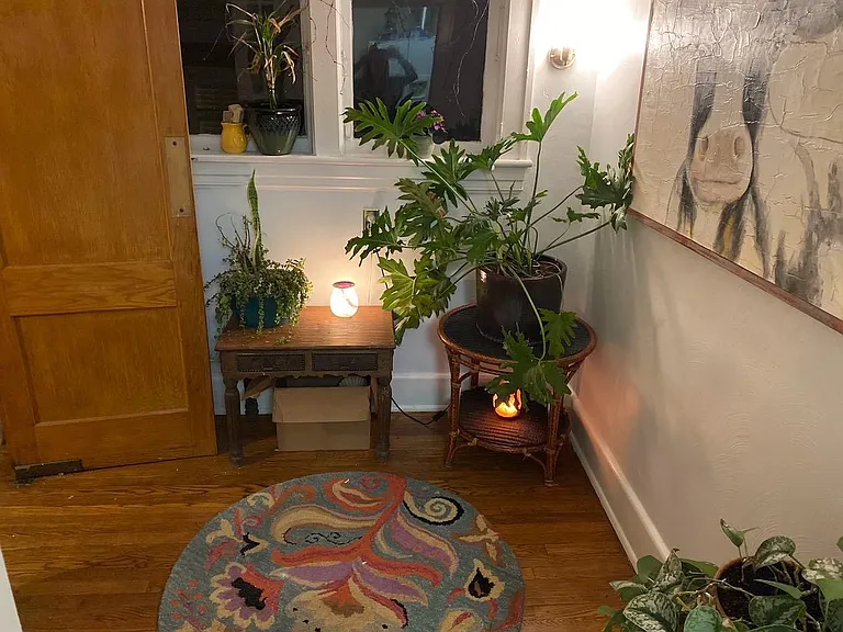 Den w/ Original Hardwood Floors. Wall Sconces have been replaced w/ Rustic Sconces.
