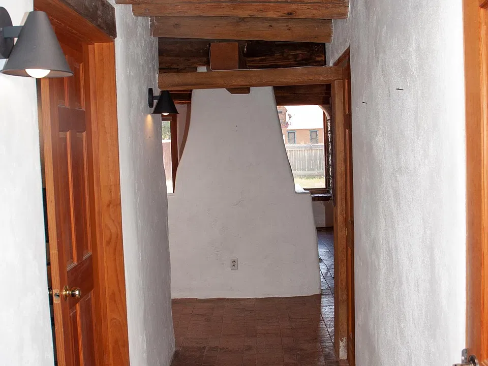 Hall to bedroom/bathroom from main living area.