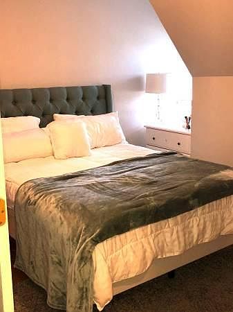 This is one of the bedrooms showing a Queen size bed. This is not the Primary.