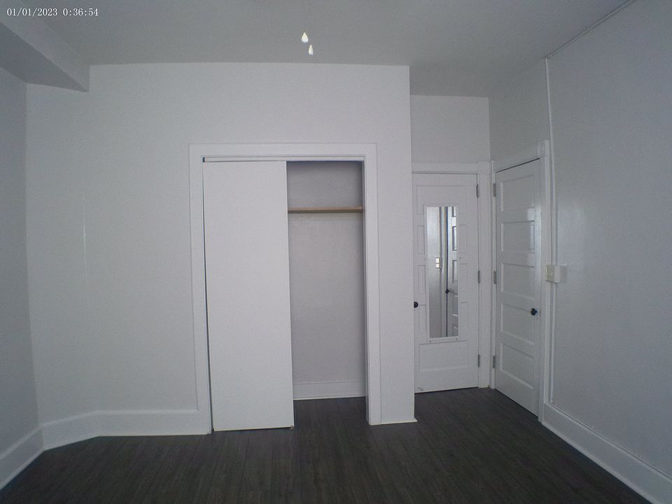 Master bedroom, ceiling fan, two closets. 2nd closet is a walk-in with lighting, multiple shelves and full-length mirror attached to closet door.